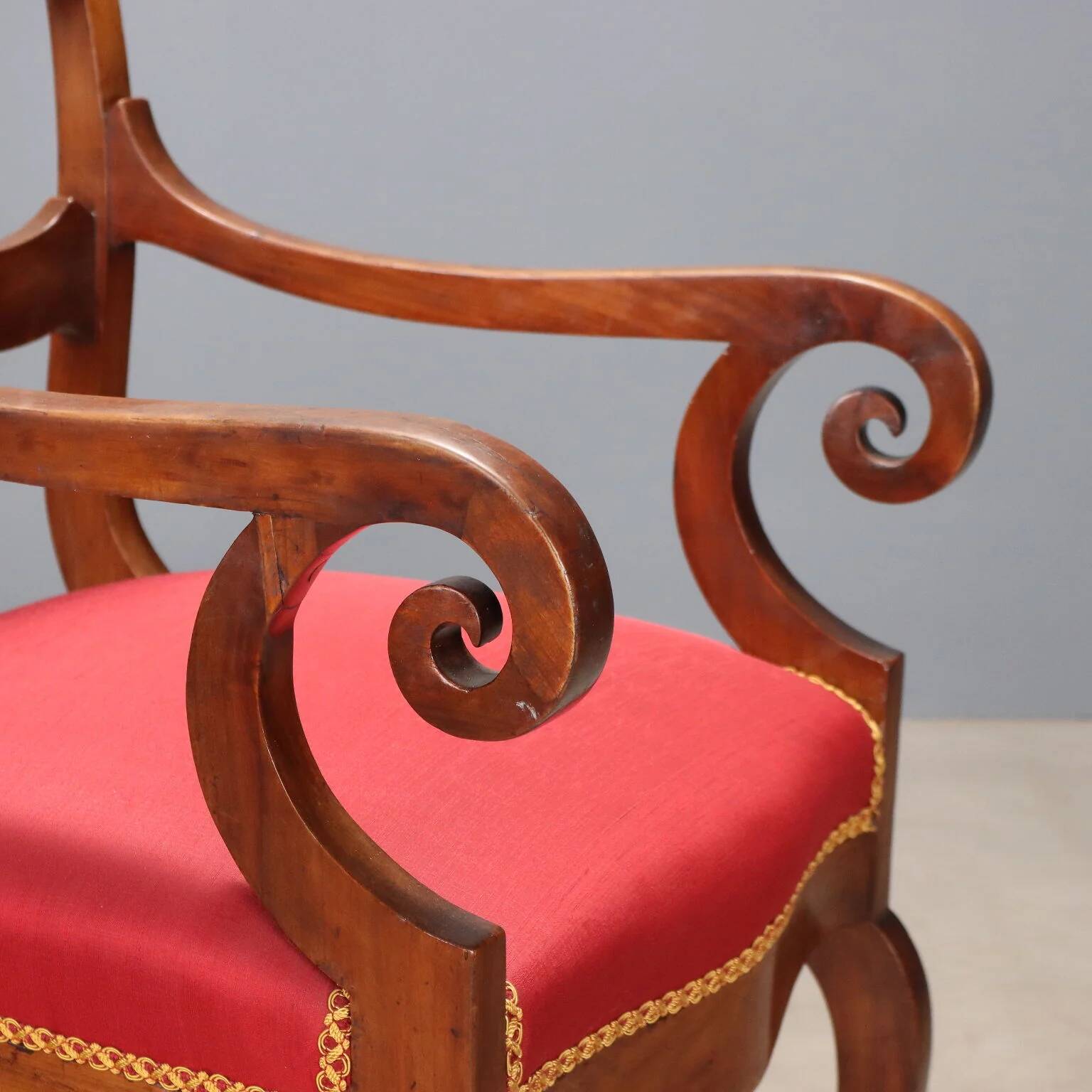 Antique Restoration-style armchair in walnut, fabric, Italy, 19th century.