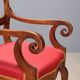 Antique Restoration-style armchair in walnut, fabric, Italy, 19th century.