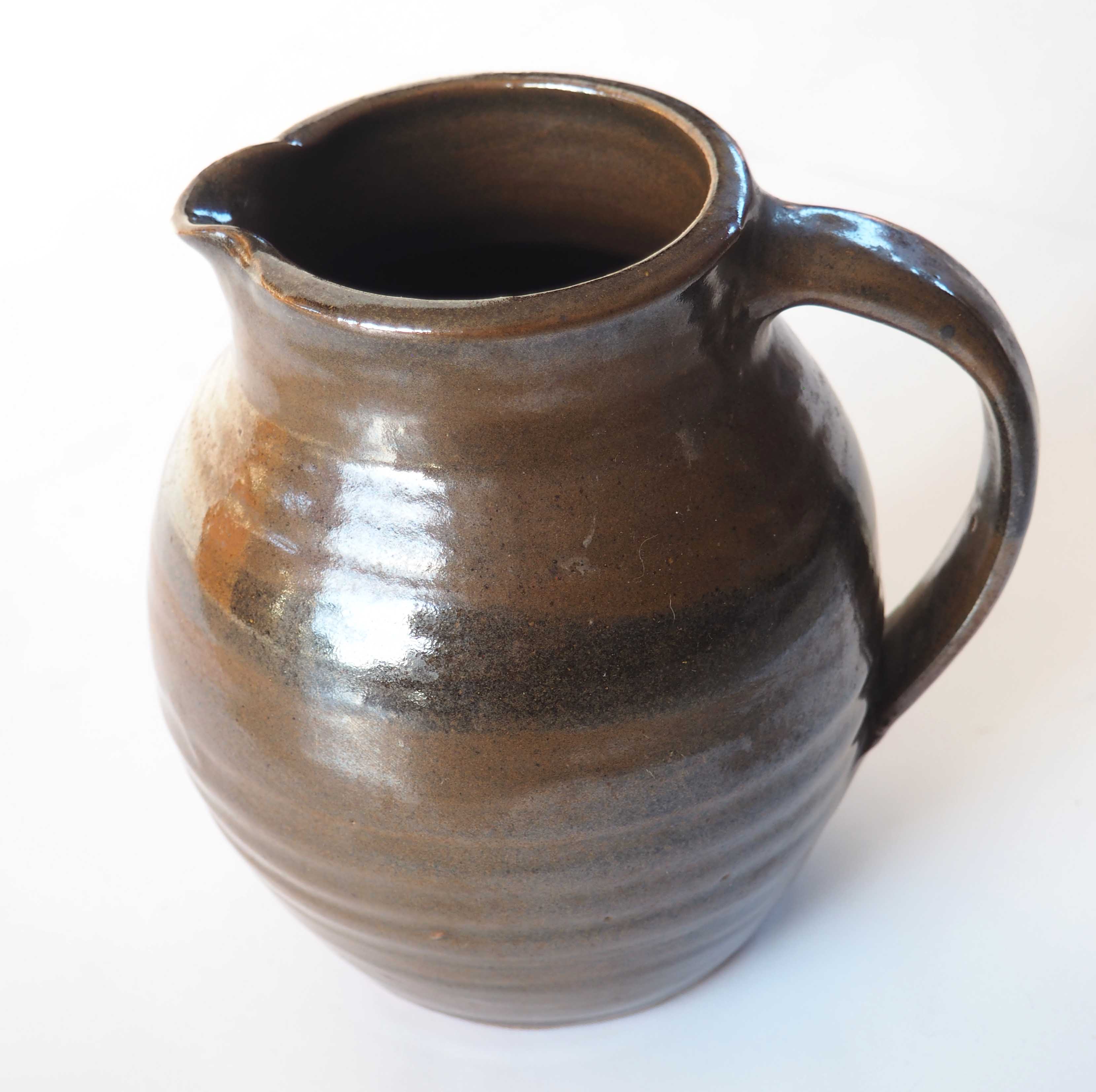 Duo of sandstone pitchers