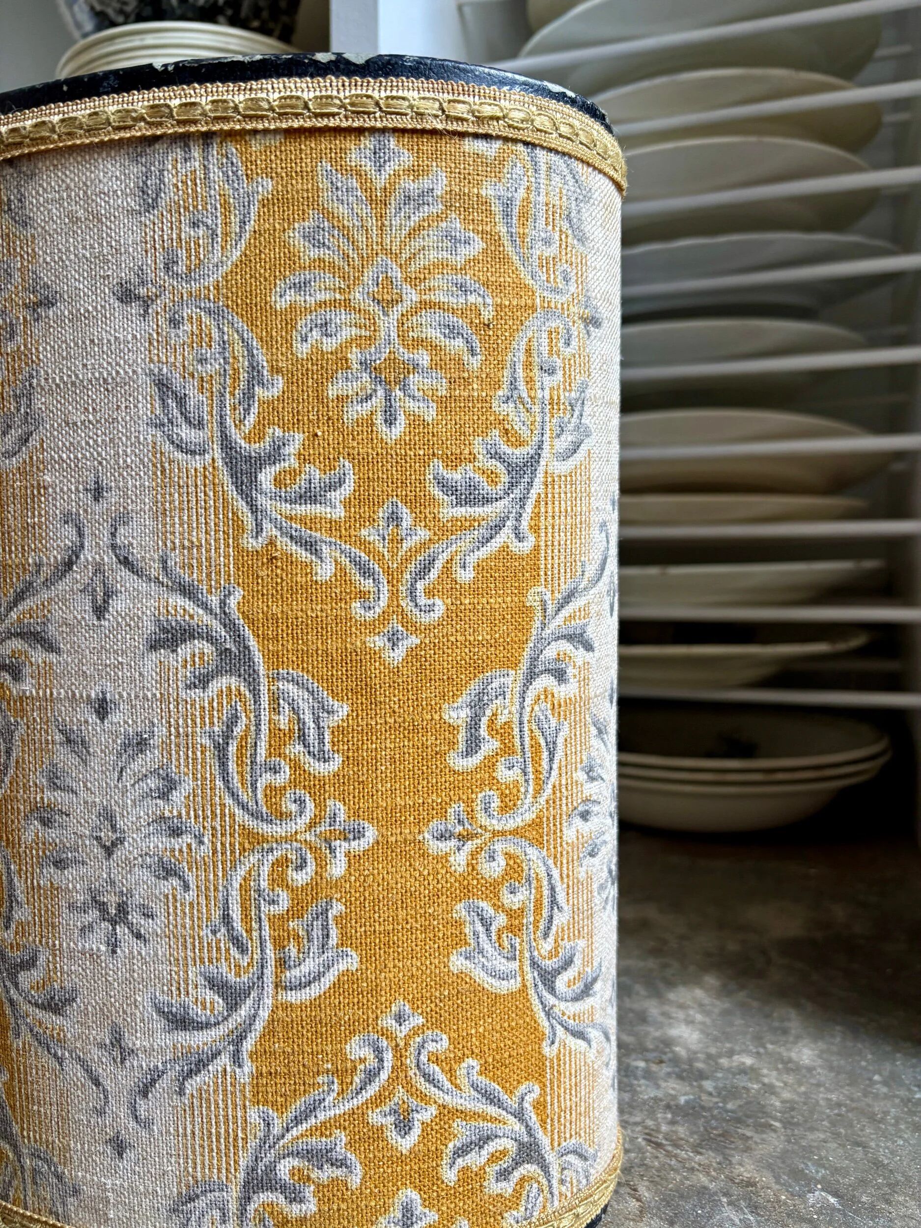 Oval paper bin in woven ochre and grey cotton