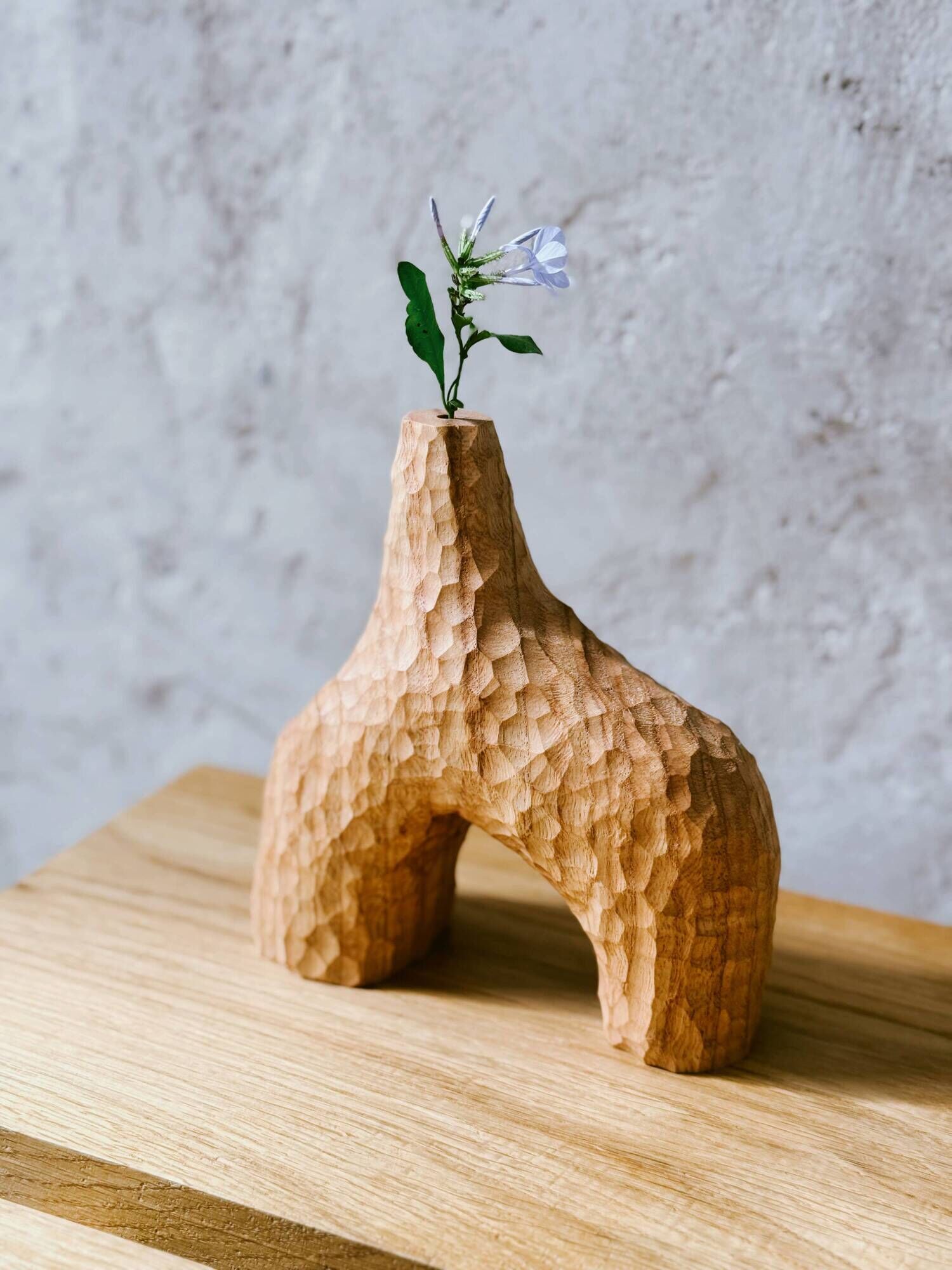 Hand-carved soliflore vase in solid chestnut wood.