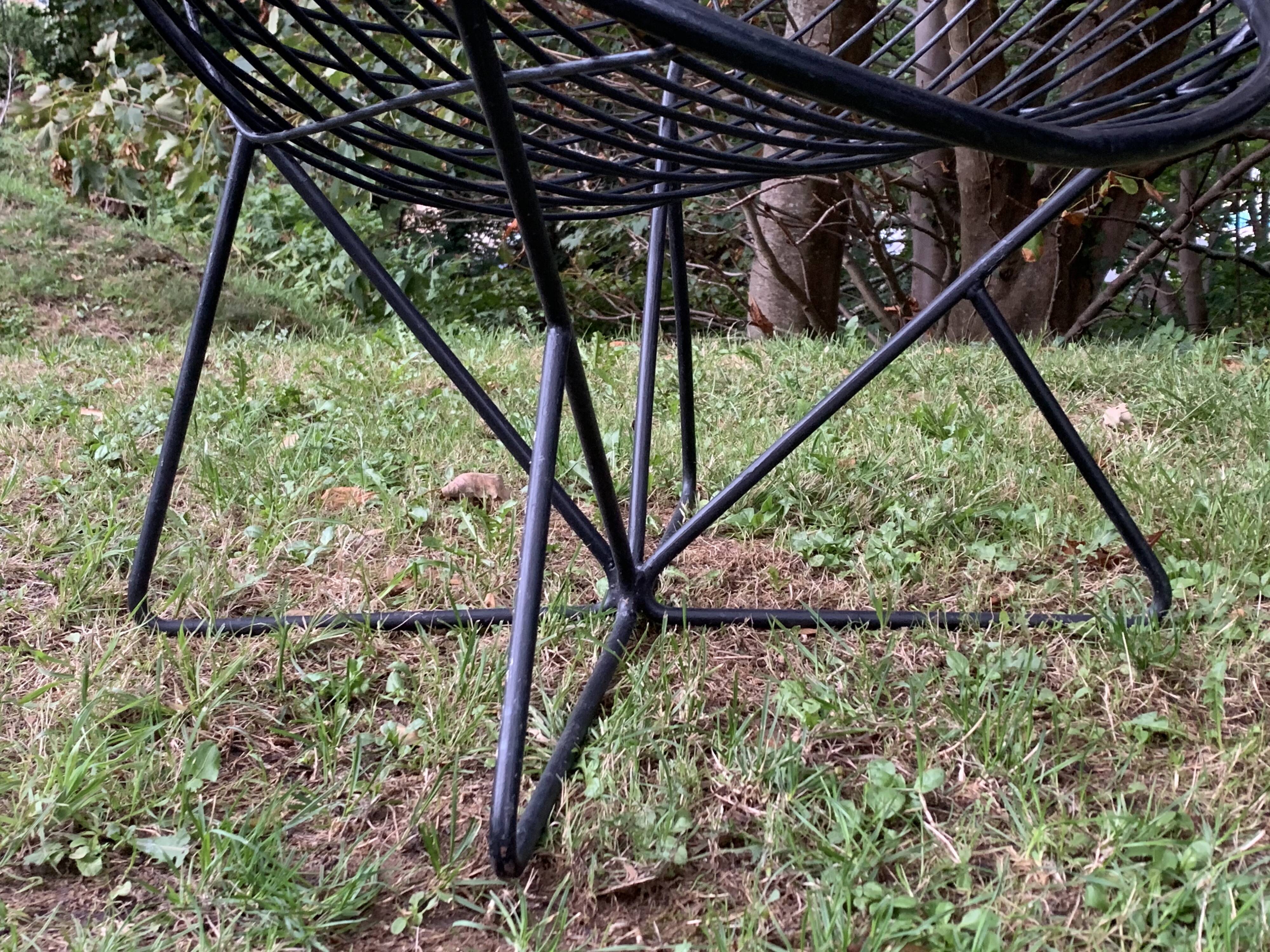 Pair of round chairs in black tubular steel 1960