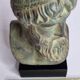 Bust of Poseidon in patinated plaster on wooden base