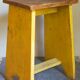 Art-populaire workshop stool in patinated painted wood