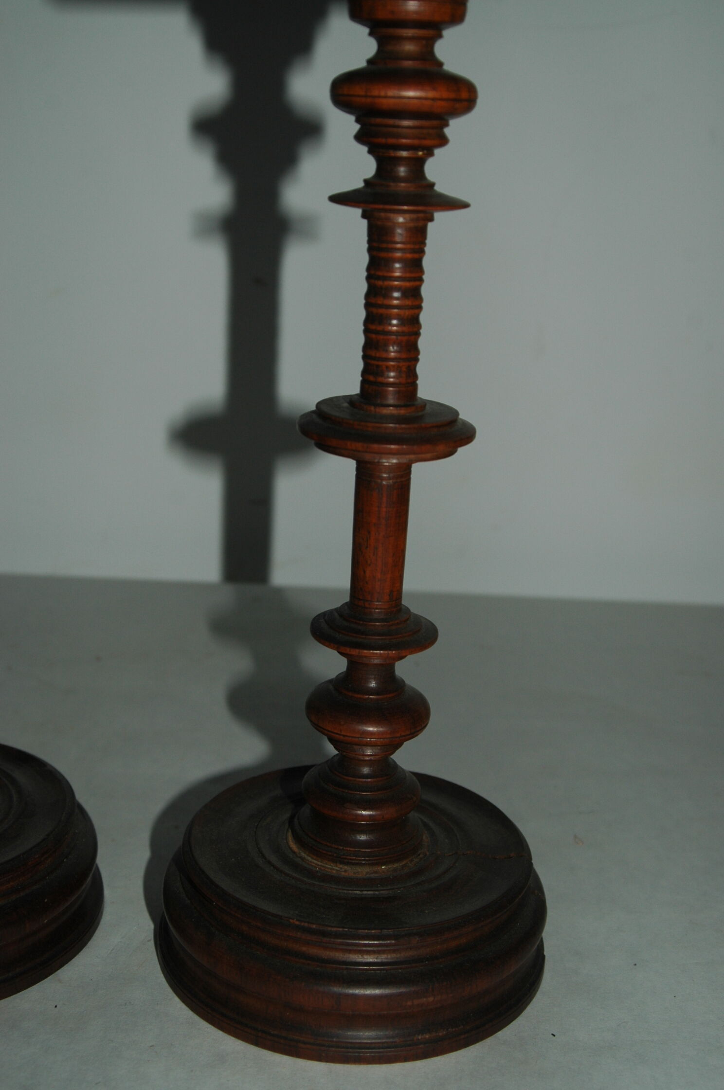 Pair of mahogany turned wood candlesticks