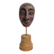 Expressive sculpted head in patinated terracotta on wooden base, 14 cm