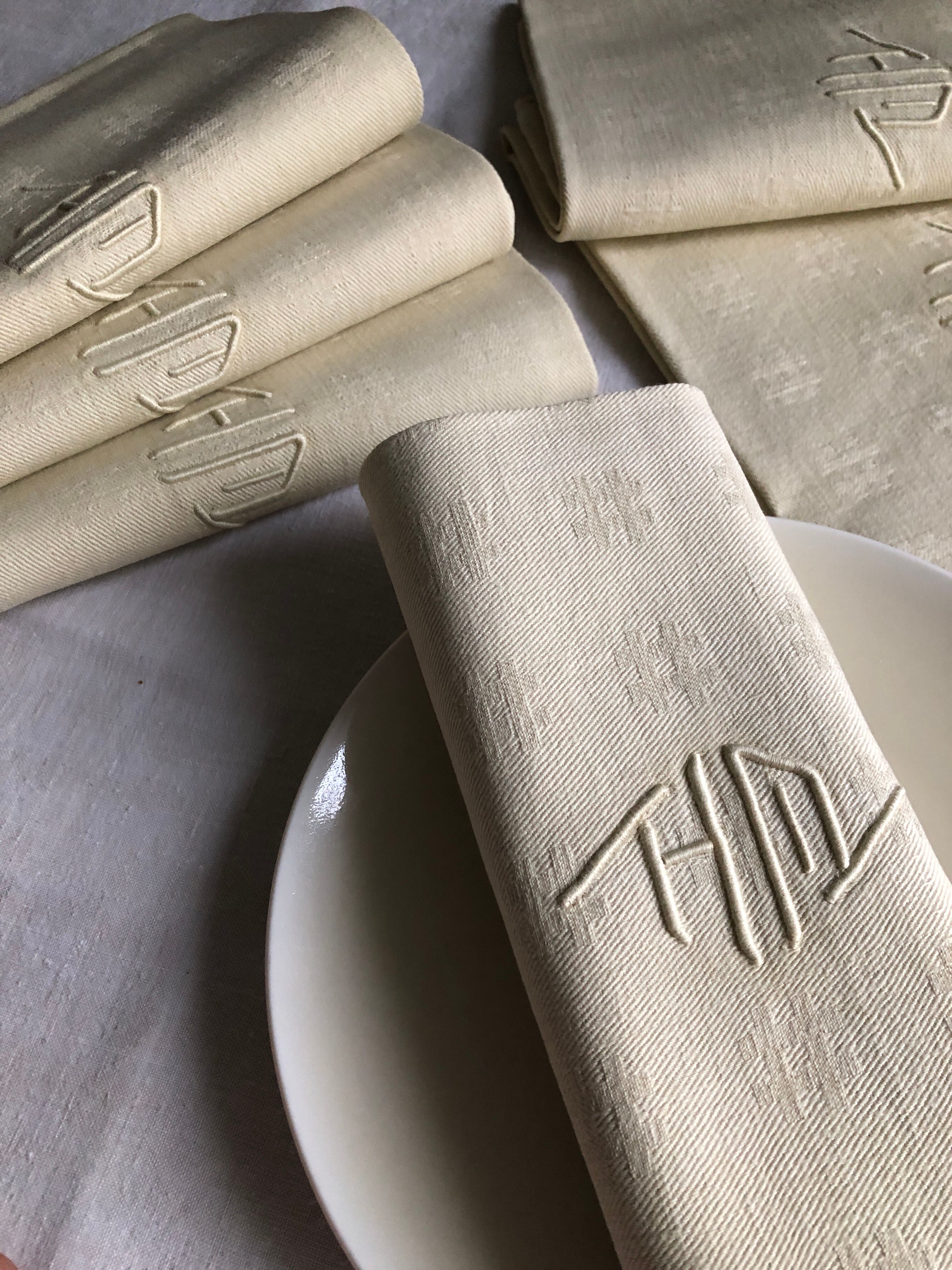 Antique napkins damascus and monogrammed tinted fresh butter
