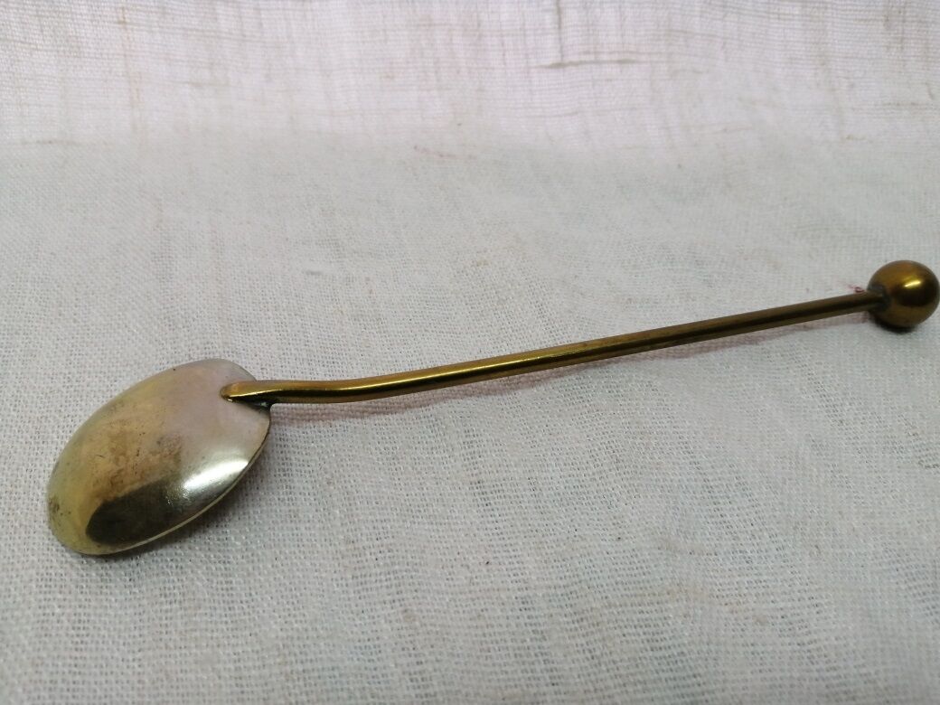 Ancient silver metal spoon and vintage brass