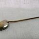 Ancient silver metal spoon and vintage brass