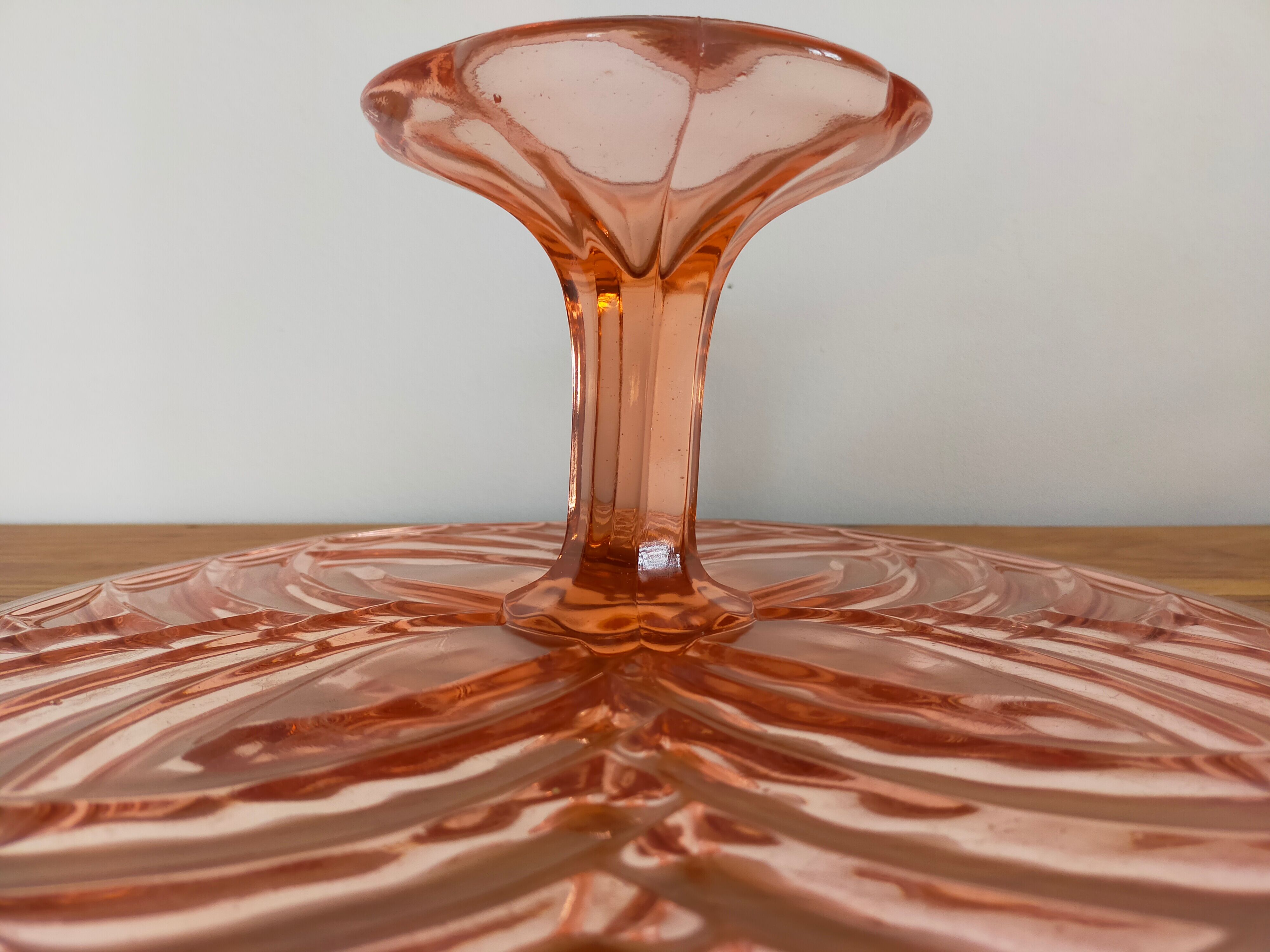 Vintage cake display in pink art deco molded glass