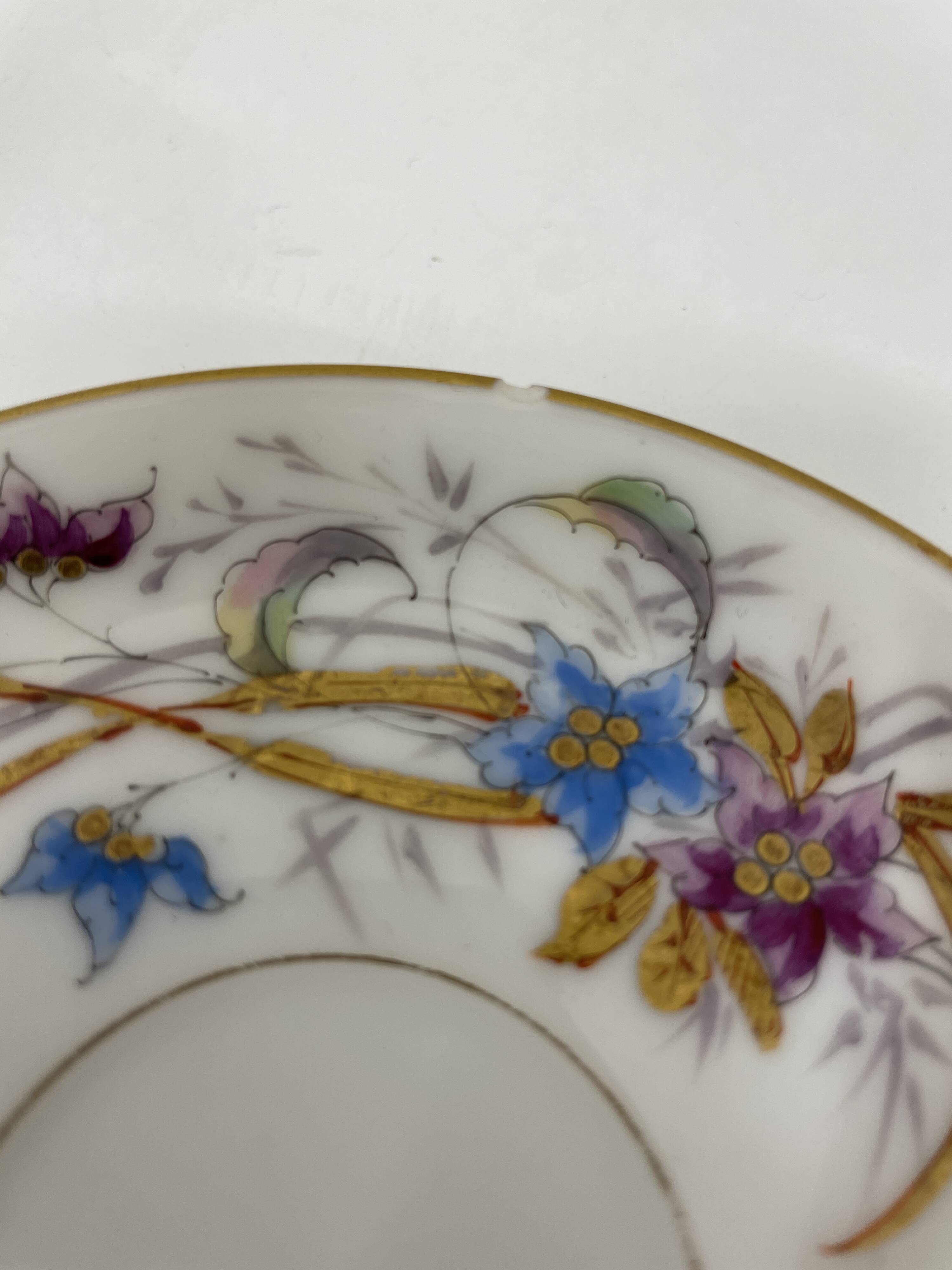 Porcelain tea service with floral and butterfly decorations, 25 pieces.