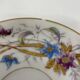Porcelain tea service with floral and butterfly decorations, 25 pieces.