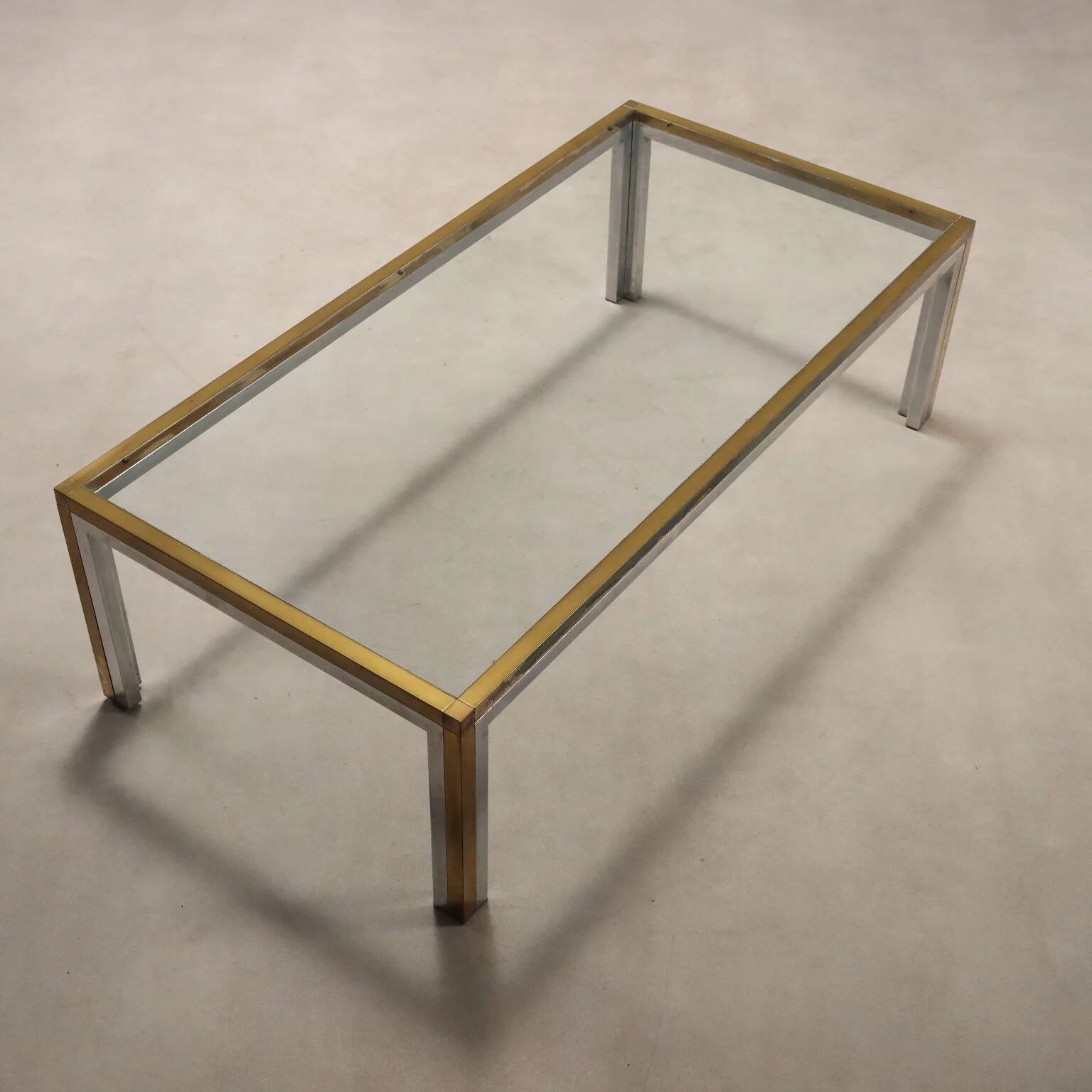 Vintage coffee table in metal, brass and glass, 1970s design.
