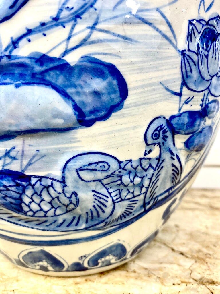 Chinese vase in blue-white porcelain decorated with lotus flowers