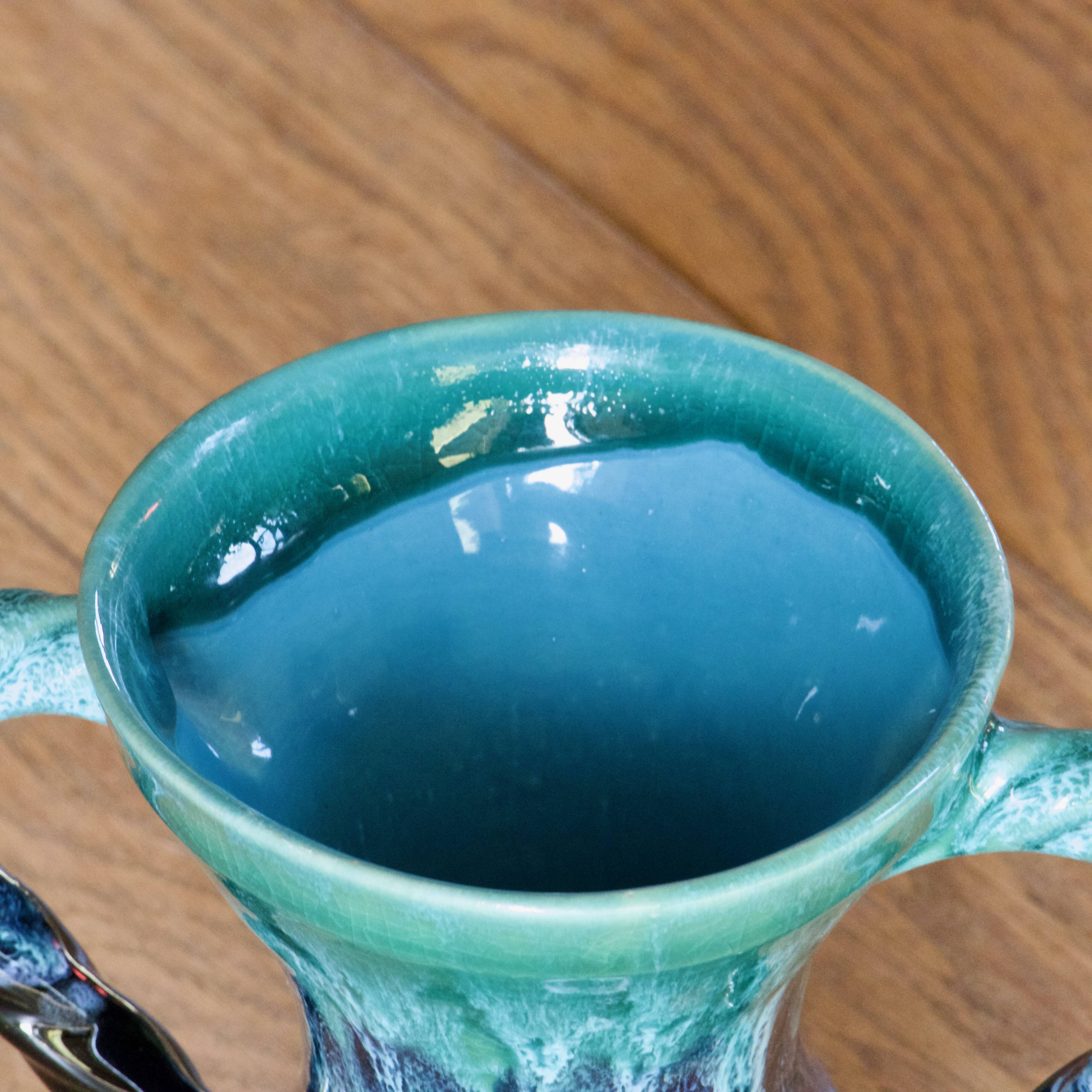 Ancient amphora vase in turquoise glazed stoneware.
