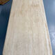 Travertine coffee table with wooden legs, Italian design from the 1970s, vintage.