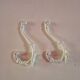 set of 2 vintage white cast iron hooks, small paint chips from the year