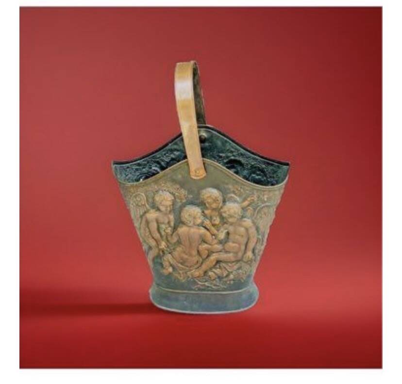 Antique red copper umbrella stand decorated with putti angels.