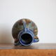 Blue vase in flaming sandstone