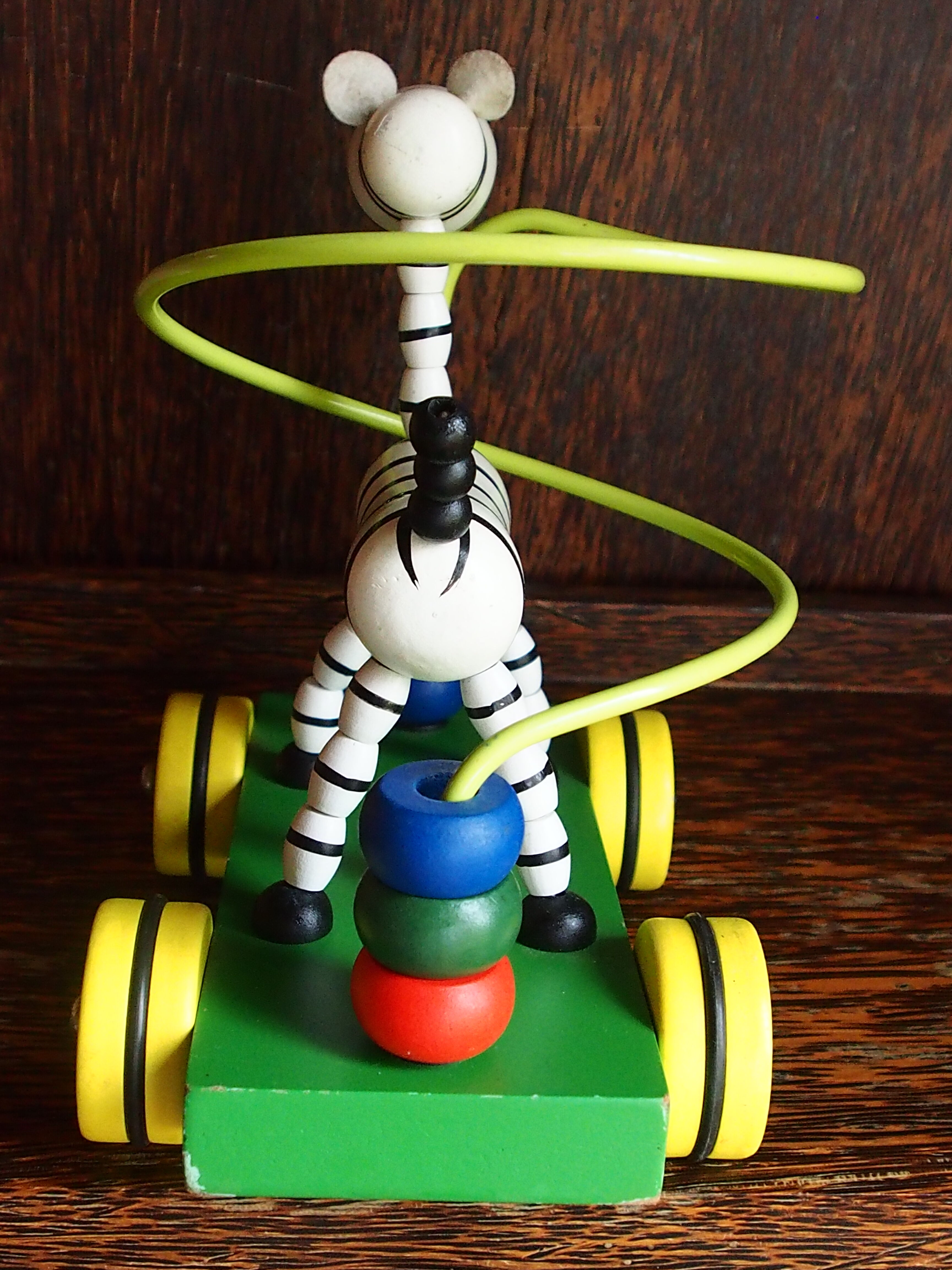 Old wooden toy, zebra car, to pull and push