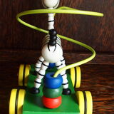 Old wooden toy, zebra car, to pull and push