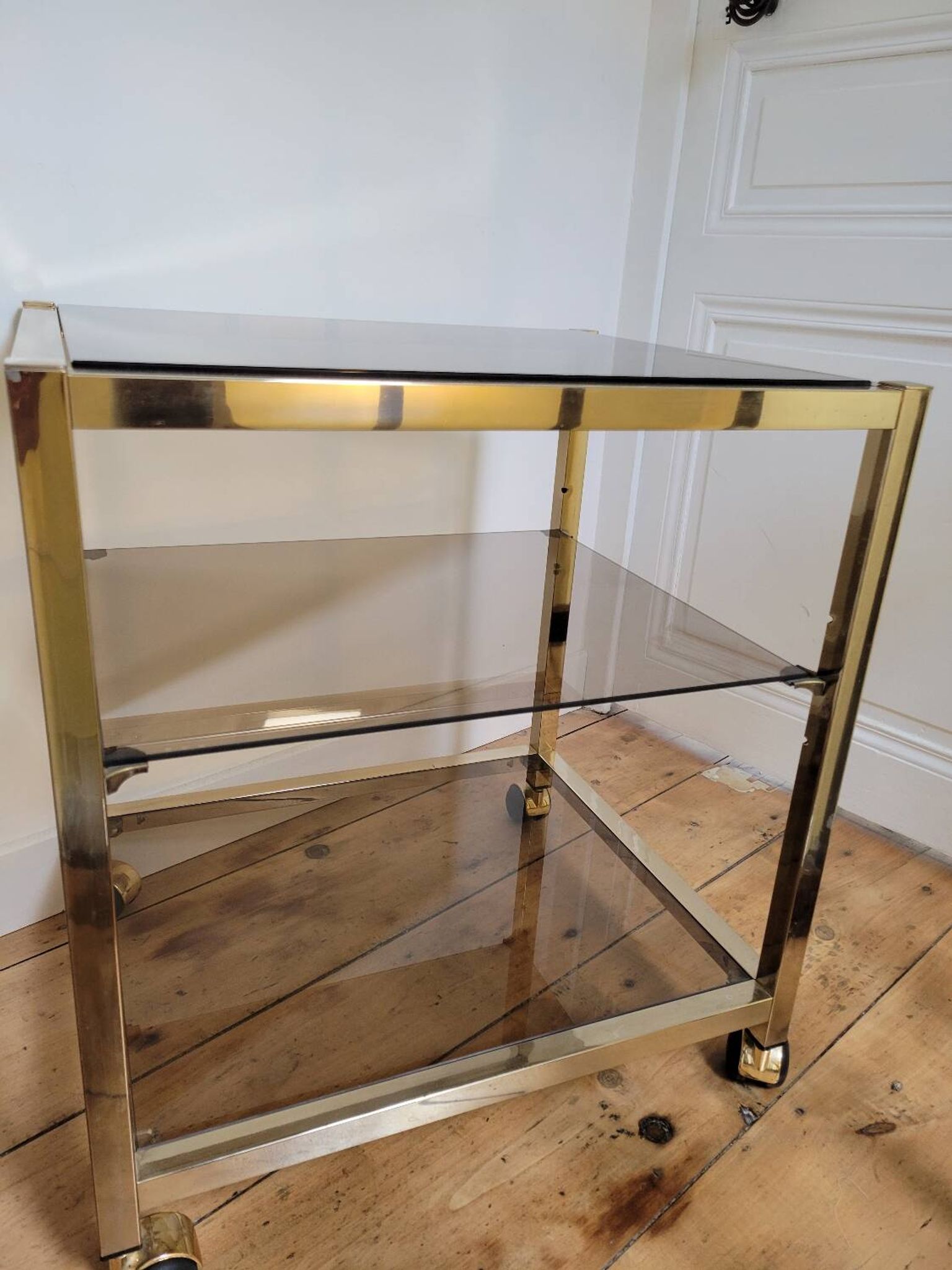 Gold metal and smoked glass serving trolley
