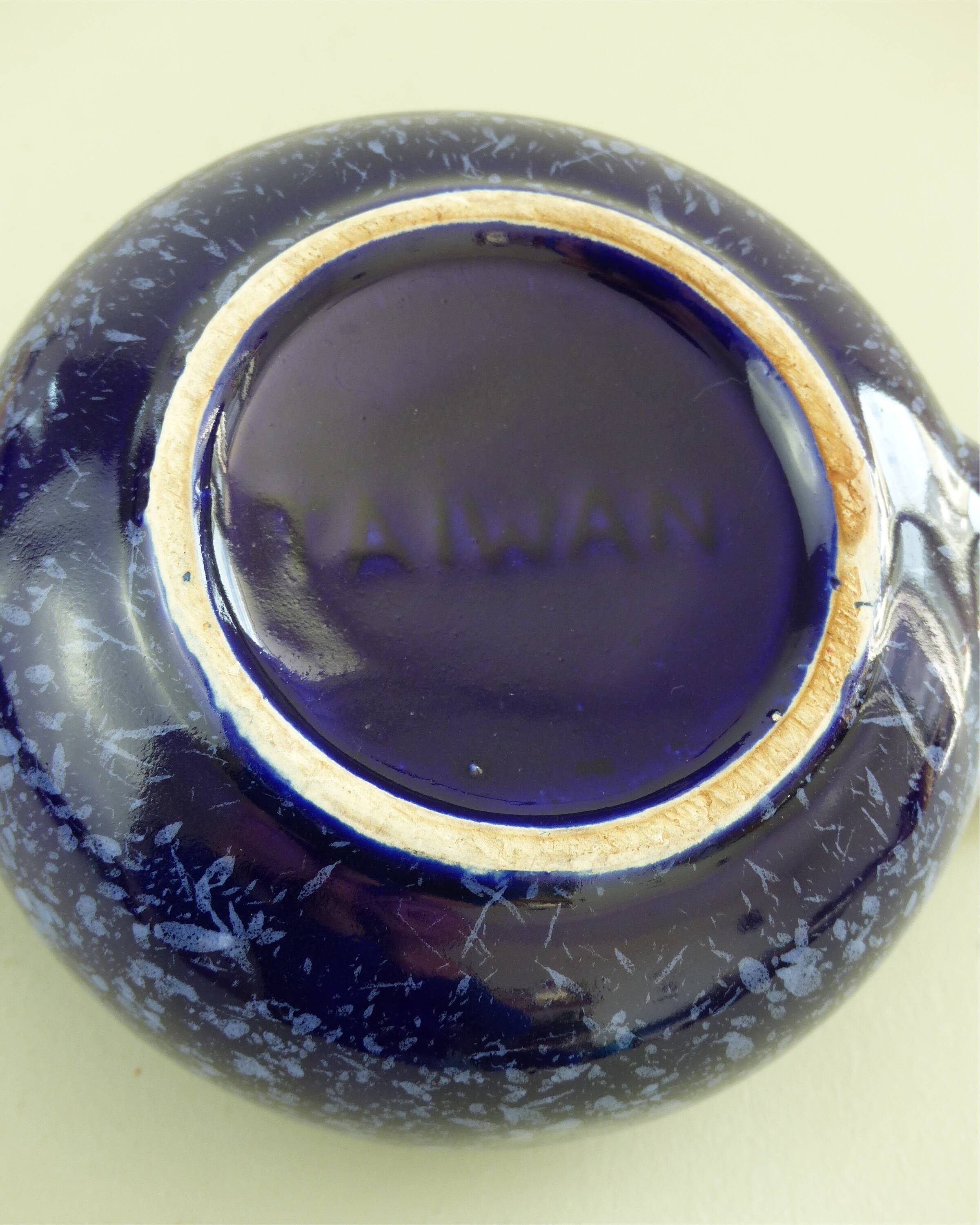 Blue glazed and speckled ceramic teapot