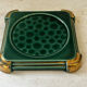 Art Deco bottle coaster in speckled green glazed ceramic and