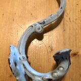 Enamelled cast iron coat hook