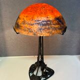 Contemporary mushroom lamp, wrought iron base and shaded orange glass shell