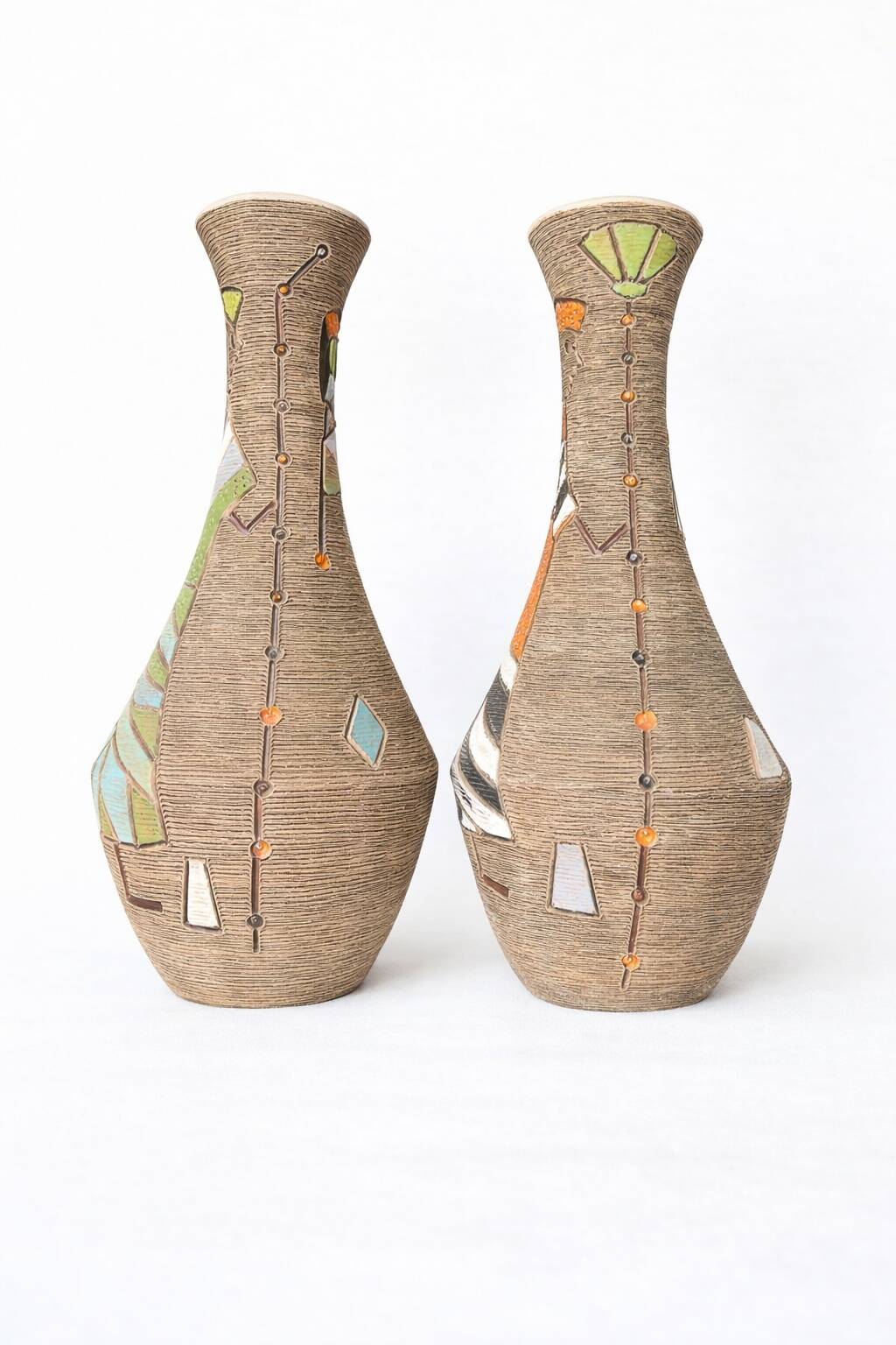 Pair of Fratelli Fanciullacci vases, sgraffito decoration with stylised figures,