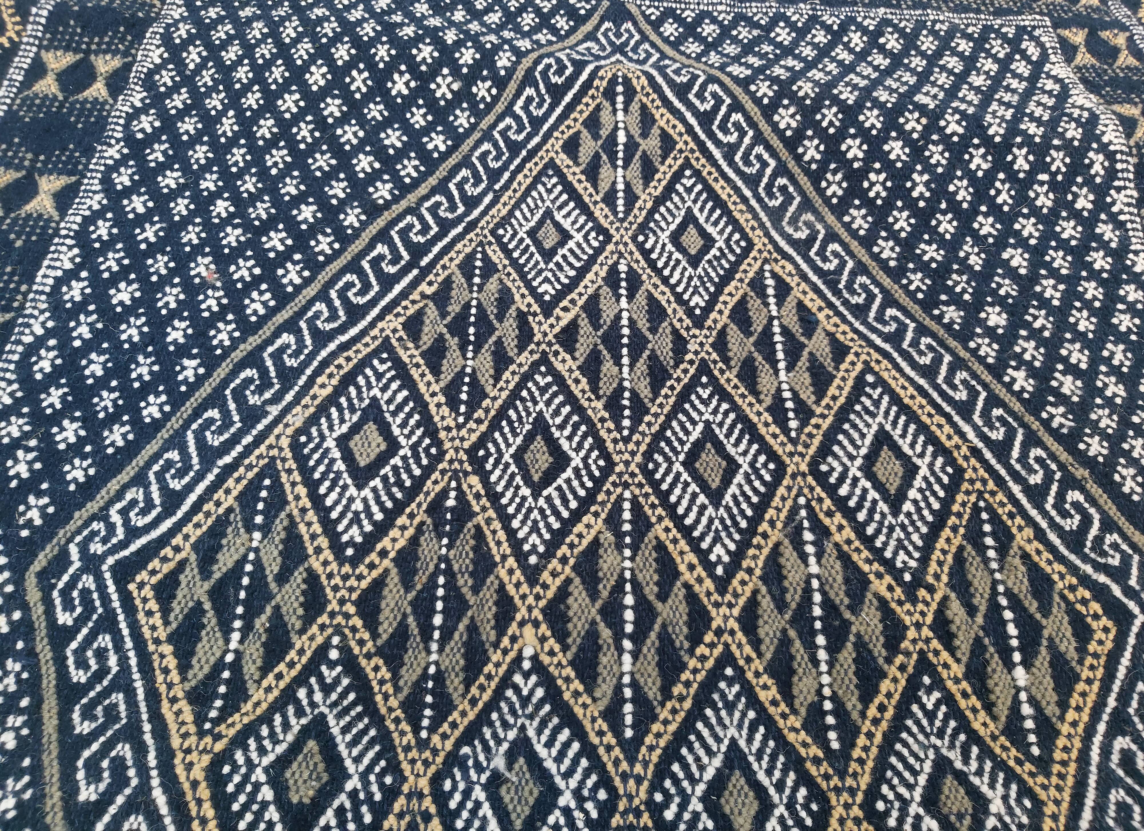 Hand-woven blue carpet in pure wool