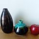 Small brown and turquoise ceramic vase
