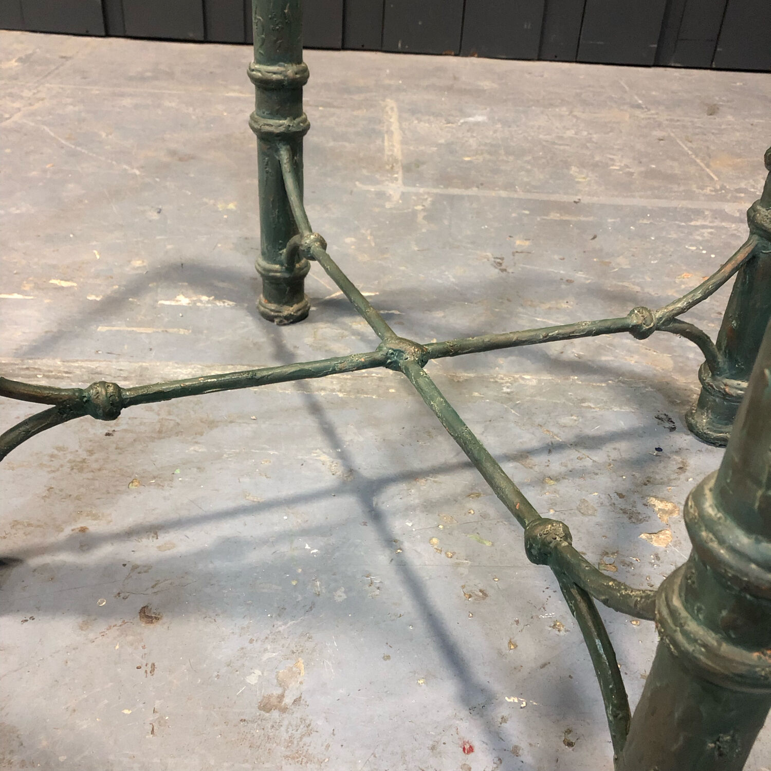 Iron and glass side table with antique patina