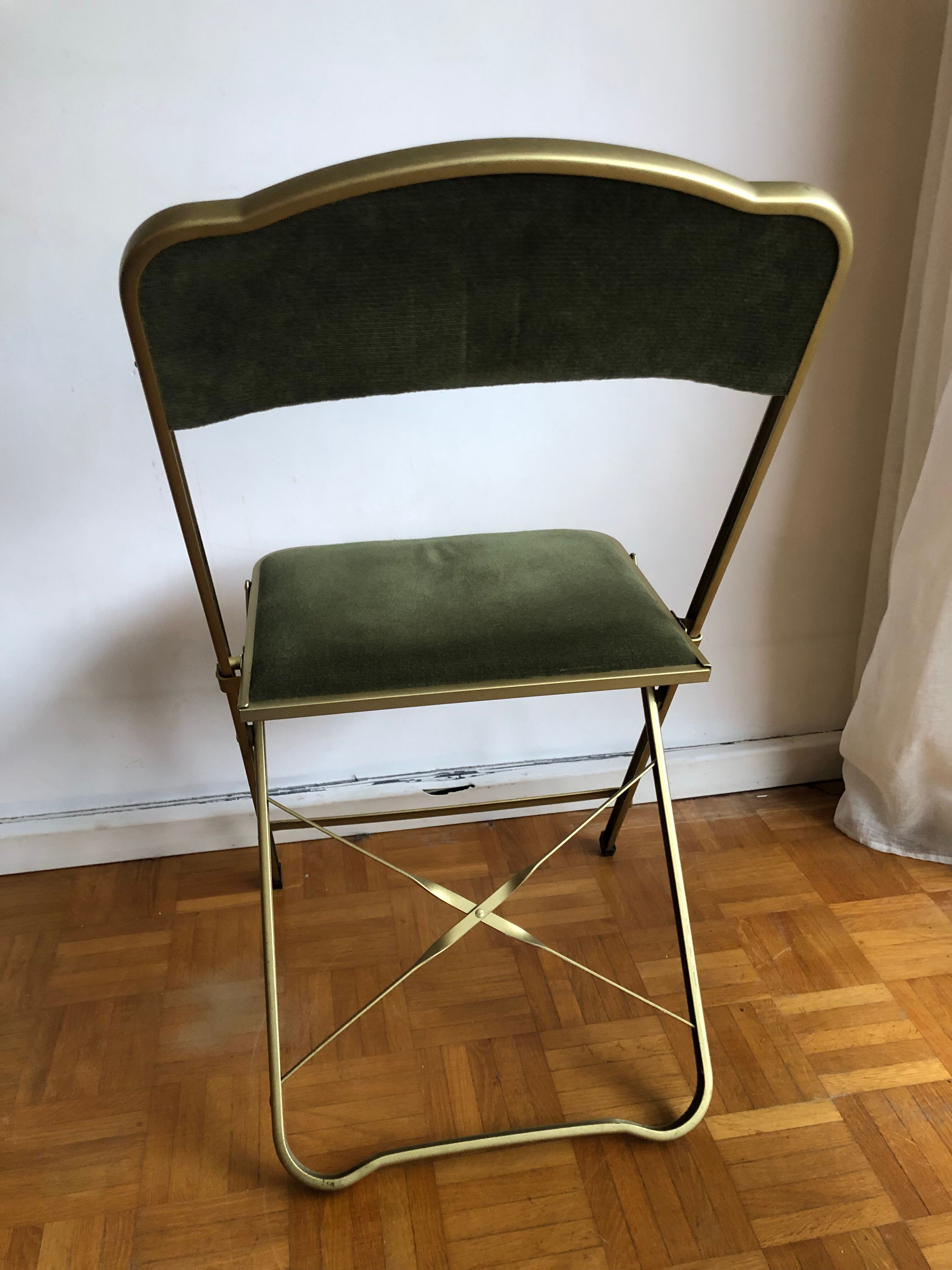 Set of three vintage green folding chairs