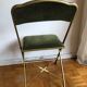 Set of three vintage green folding chairs