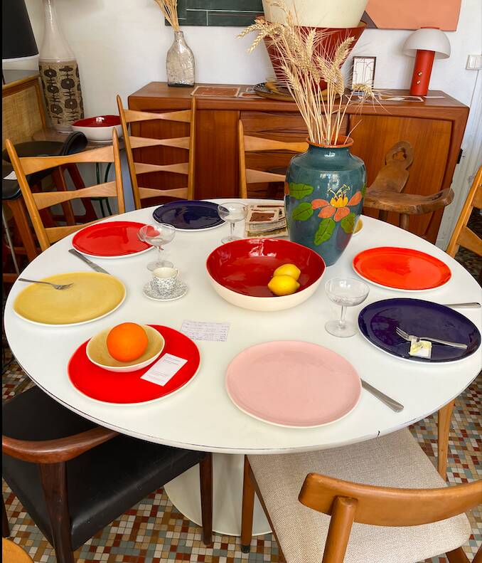 White dining table with tulip base by Maurice Burke