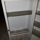 White lacquered metal medicine cabinet