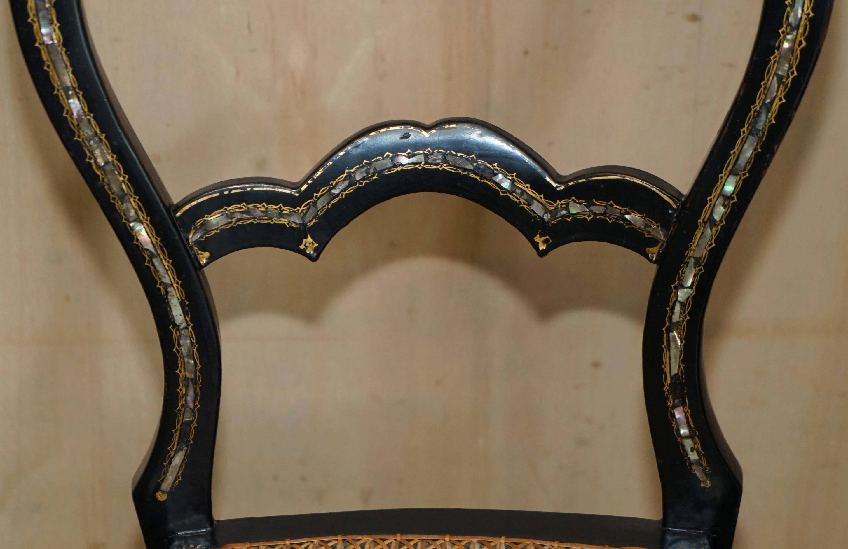 Four antique Regency bergère chairs with mother-of-pearl inlay.