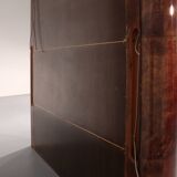 Iconic Aldo Tura brown goatskin bar cabinet with electric lift & mirror interior.