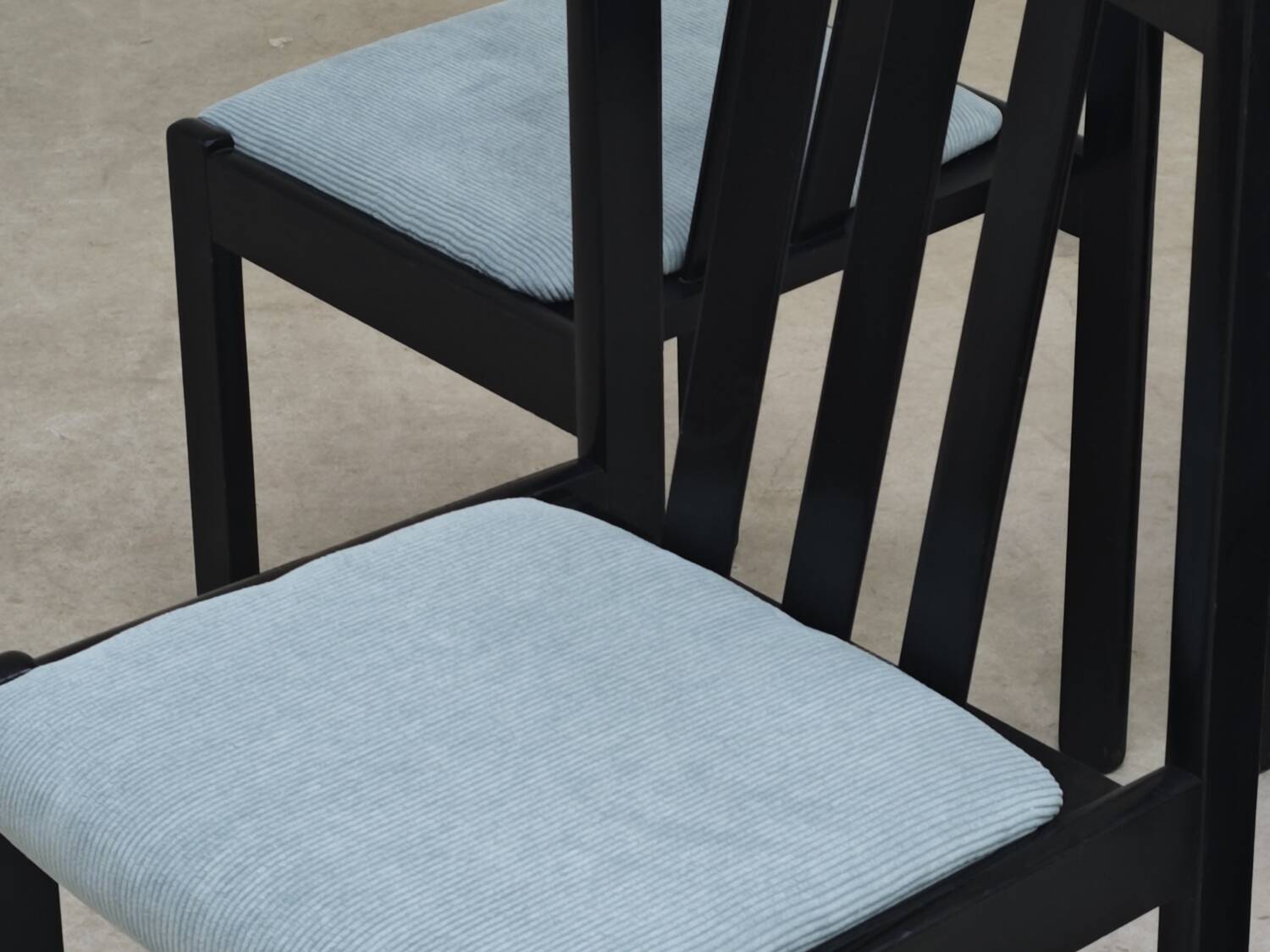 Set of 4 modernist black chairs with light blue ribbed fabric