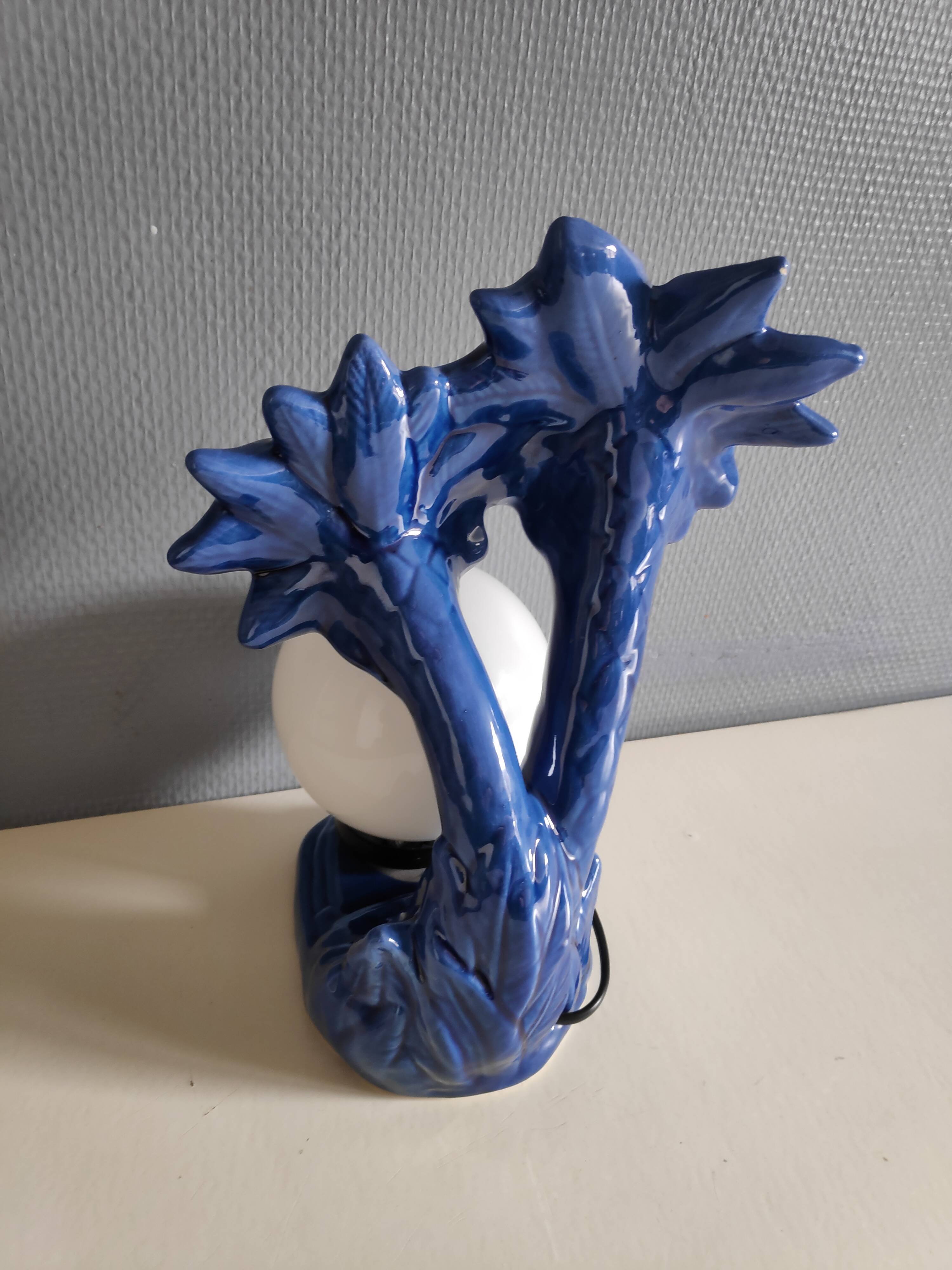 Blue ceramic palm lamp and white opaline globe