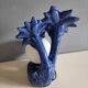 Blue ceramic palm lamp and white opaline globe