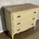 Old chest of drawers refurbished in beige cream
