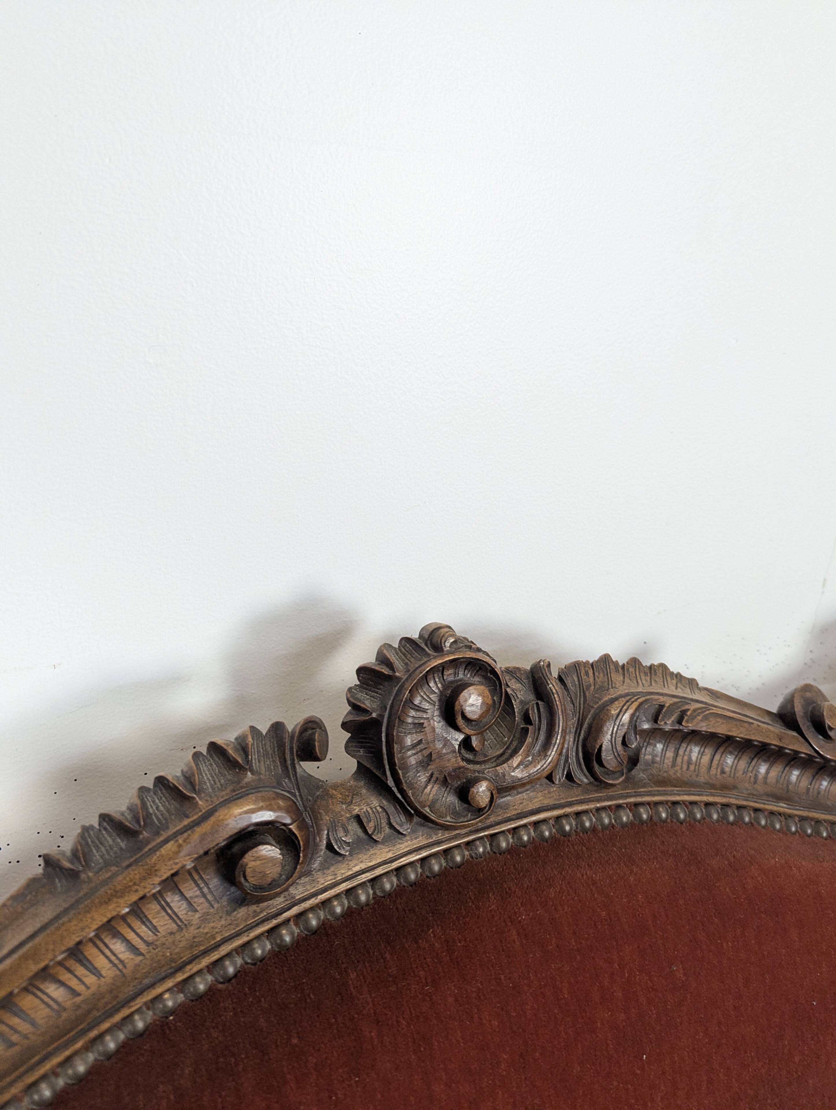 Louis XV style salon in carved walnut with orange velvet, seven pieces.