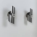 Pair of vintage wall lights, curved patinated steel, France, 1970.