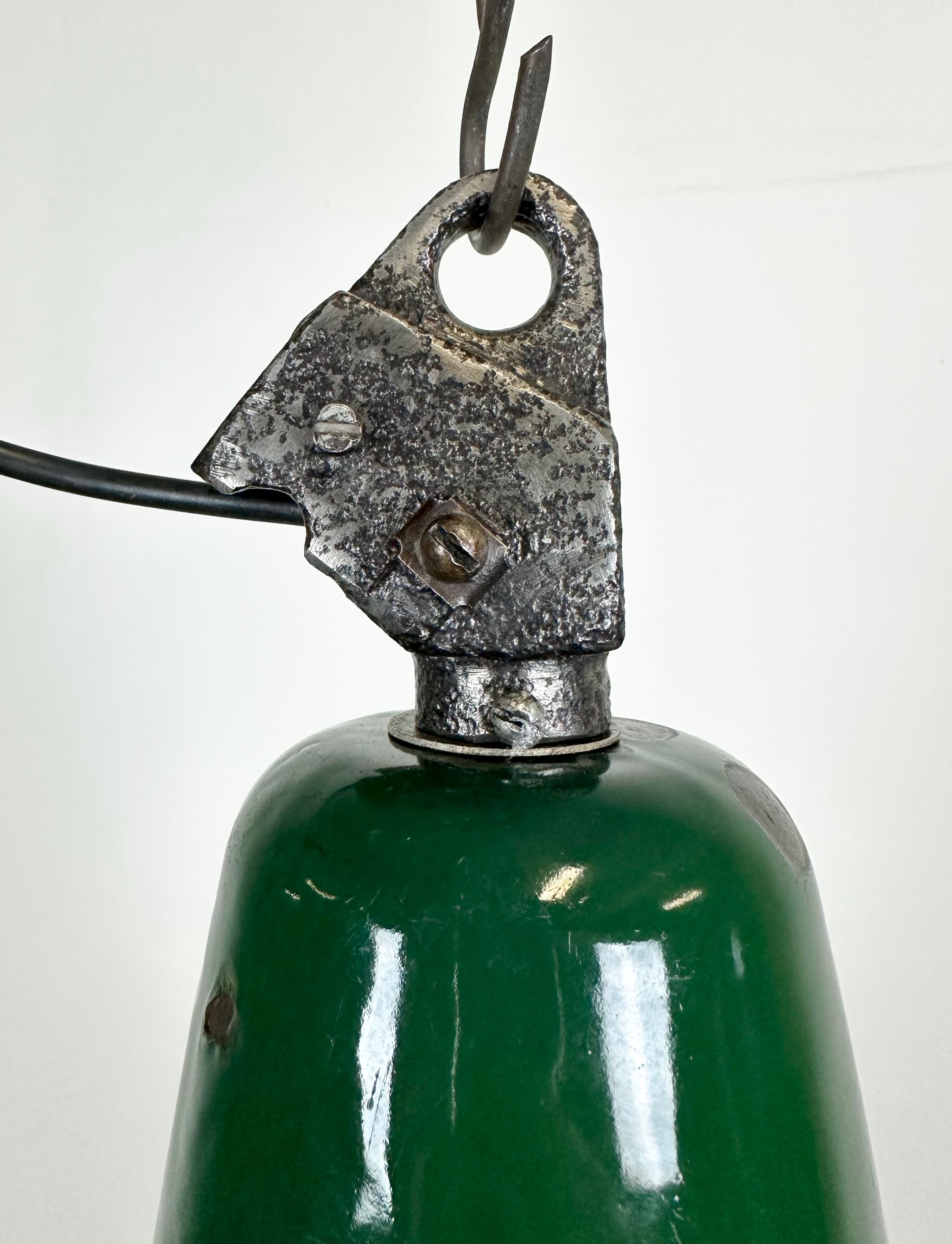 Industrial green enamel factory lamp with cast iron top, 1960s
