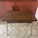 Vintage extendable kitchen table with wood effect Formica and chrome legs.