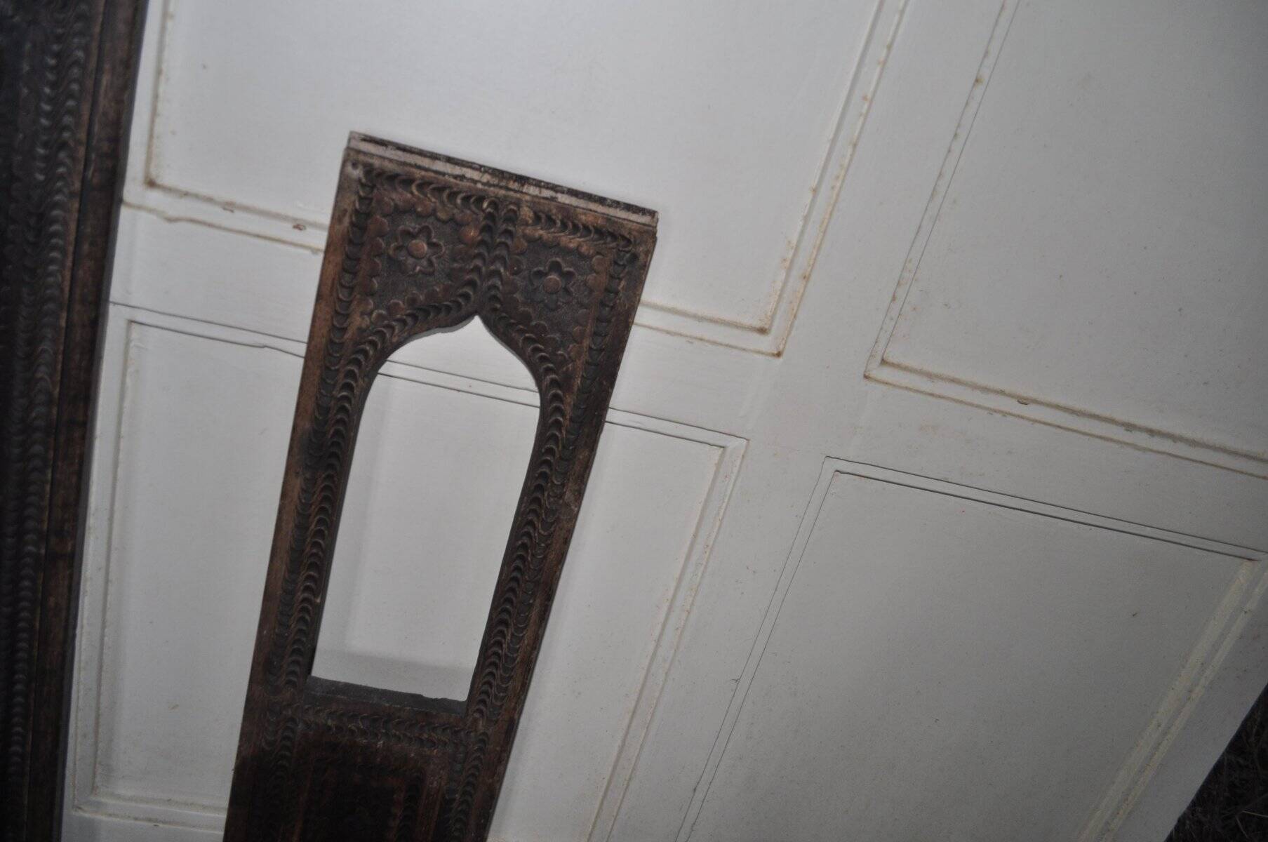 Set of 2 carved brown wooden panels, rural Hungary, 1940s, geometric patterns.