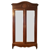 Louis XV style armoire with two bevelled mirror doors.